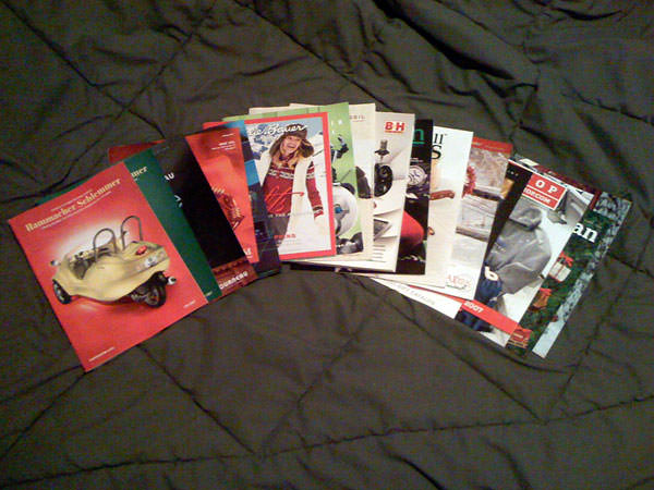 Picture of a lot of catalogs on my bed