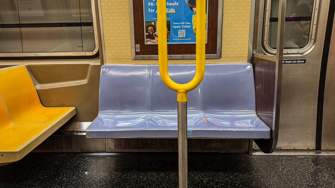 Blue seats in the subway car