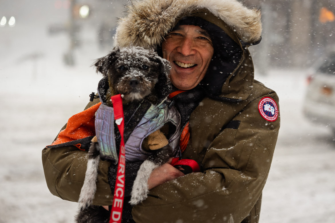 Man carrying his dog