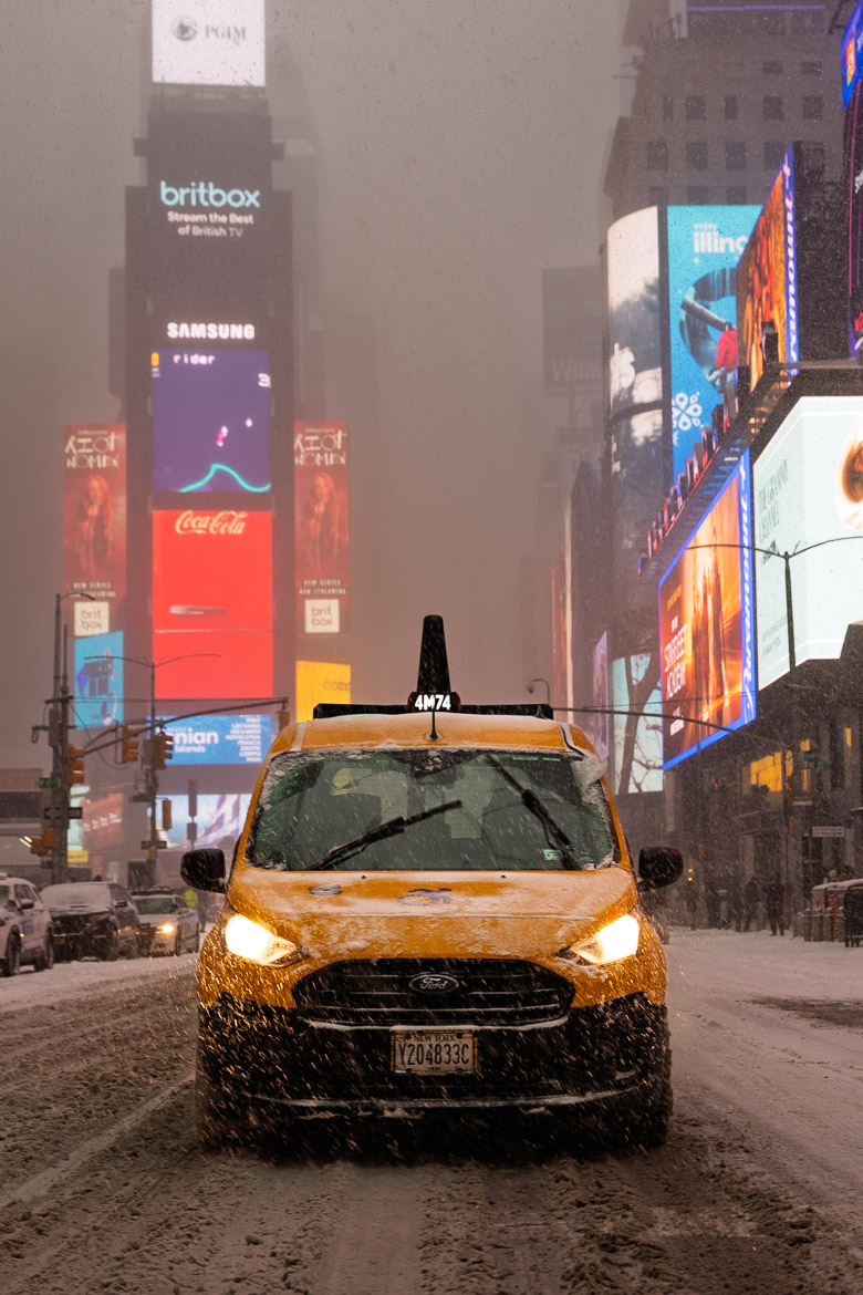 NYC taxi in the snow in Times Square